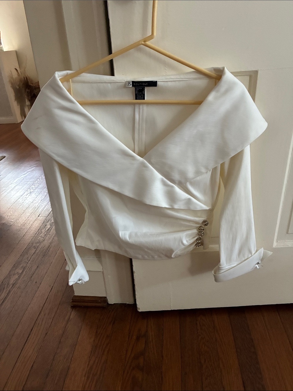 JS Boutique Cream Off-Shoulder Wrap Blouse with Side Embellishment